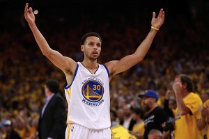 OAKLAND, CA - MAY 27:  Stephen Curry #30 of the Golden State Warriors celebrates late in the fourth quarter against the Houston Rockets during game five of the Western Conference Finals of the 2015 NBA Playoffs at ORACLE Arena on May 27, 2015 in Oakland, California. NOTE TO USER: User expressly acknowledges and agrees that, by downloading and or using this photograph, user is consenting to the terms and conditions of Getty Images License Agreement.  (Photo by Ezra Shaw/Getty Images)