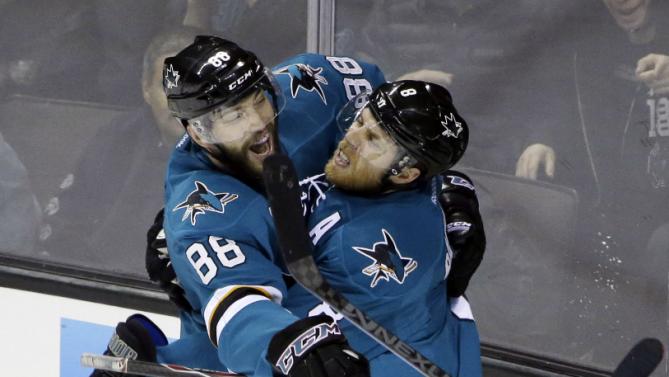 San Jose Sharks' Joe Pavelski, right, celebrates his goal with teammate Brent Burns (88) during the first period of an NHL hockey game against the St. Louis Blues on Saturday, Jan. 3, 2015, in San Jose, Calif. (AP Photo/Marcio Jose Sanchez)