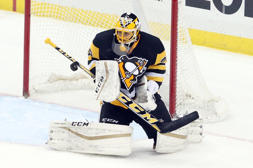 Jan 2, 2016; Pittsburgh, PA, USA; Pittsburgh Penguins goalie Marc-Andre Fleury (29) makes a save against the New York Islanders during the second period at the CONSOL Energy Center. Mandatory Credit: Charles LeClaire-USA TODAY Sports
