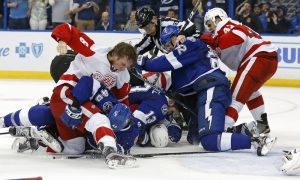 TAMPA, FL - APRIL 15:  Members of the Detroit Red Wings and Tampa Bay Lightning fight during the third  period in Game Two of the Eastern Conference Quarterfinals during the 2016 NHL Stanley Cup Playoffs at Amalie Arena on April 15, 2016 in Tampa, Florida. (Photo by Mike Carlson/Getty Images) ORG XMIT: 629093049 ORIG FILE ID: 521454432