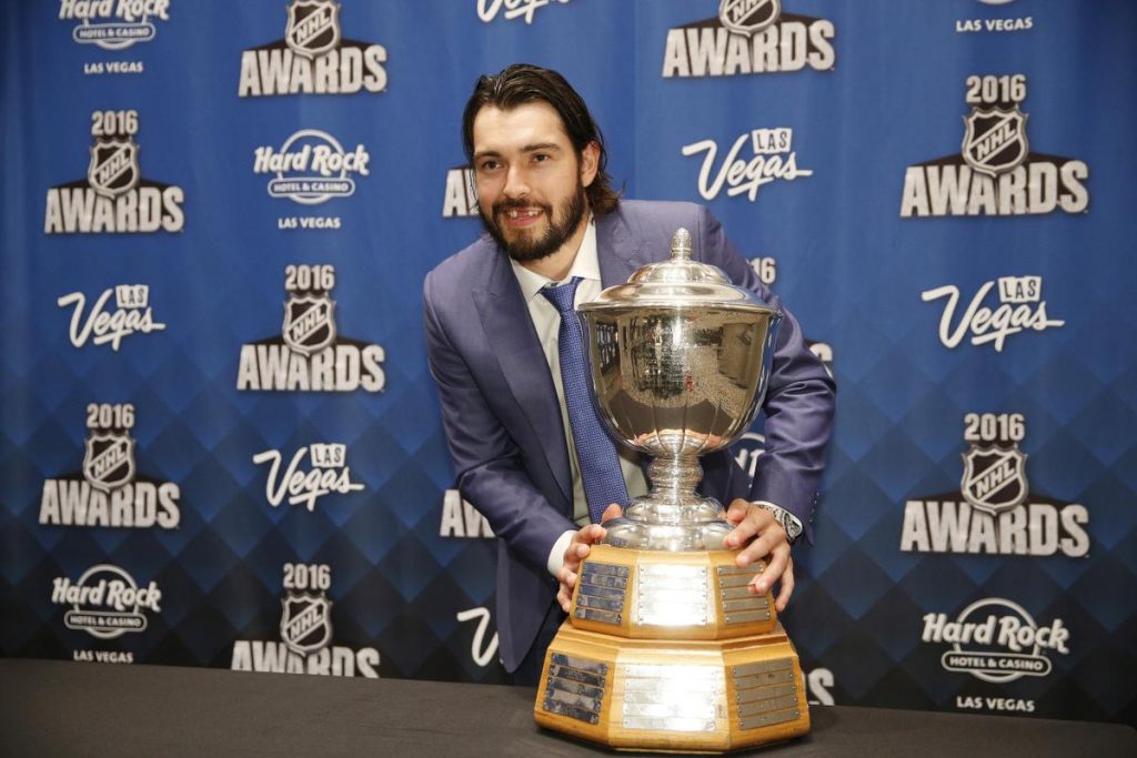 Los Angeles Kings' Drew Doughty holds the Norris Trophy after winning the award at the NHL Awards show, Wednesday, June 22, 2016, in Las Vegas. (AP Photo/John Locher)