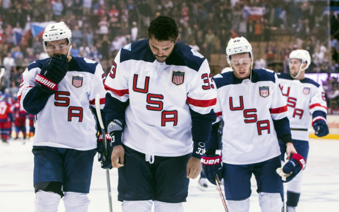 Team USA's Dustin Byfuglien, centre, Matt Niskanen, left, and Patrick Kane, right, leave the ice after their team lost to Team Czech Republic in World Cup of Hockey action in Toronto, Thursday, Sept. 22, 2016. (Mark Blinch/The Canadian Press via AP) ORG XMIT: MDB113