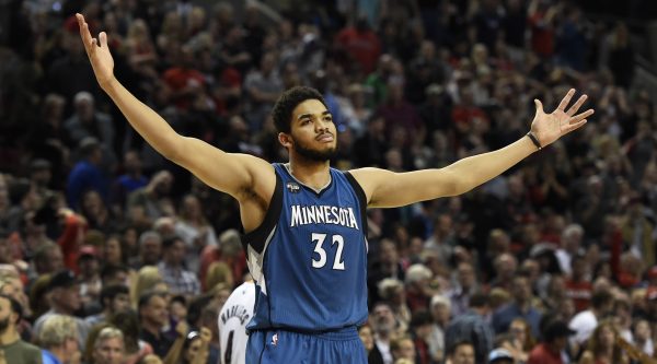 Minnesota Timberwolves center Karl-Anthony Towns celebrates after hitting the game-winning shot in an NBA basketball game against the Portland Trail Blazers in Portland, Ore., Saturday, April 9, 2016. The Timberwolves won 106-105. (AP Photo/Steve Dykes)