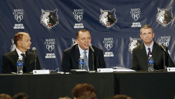Tom Thibodeau, center, addresses the media and a gathering of fans after he was introduced as the new Minnesota Timberwolves NBA basketball head coach Tuesday, April 26, 2016, in Minneapolis. Listening, left, is Timberwolves owner Glen Taylor, and right, new general manager Scott Layden who was also introduced .(AP Photo/Jim Mone)