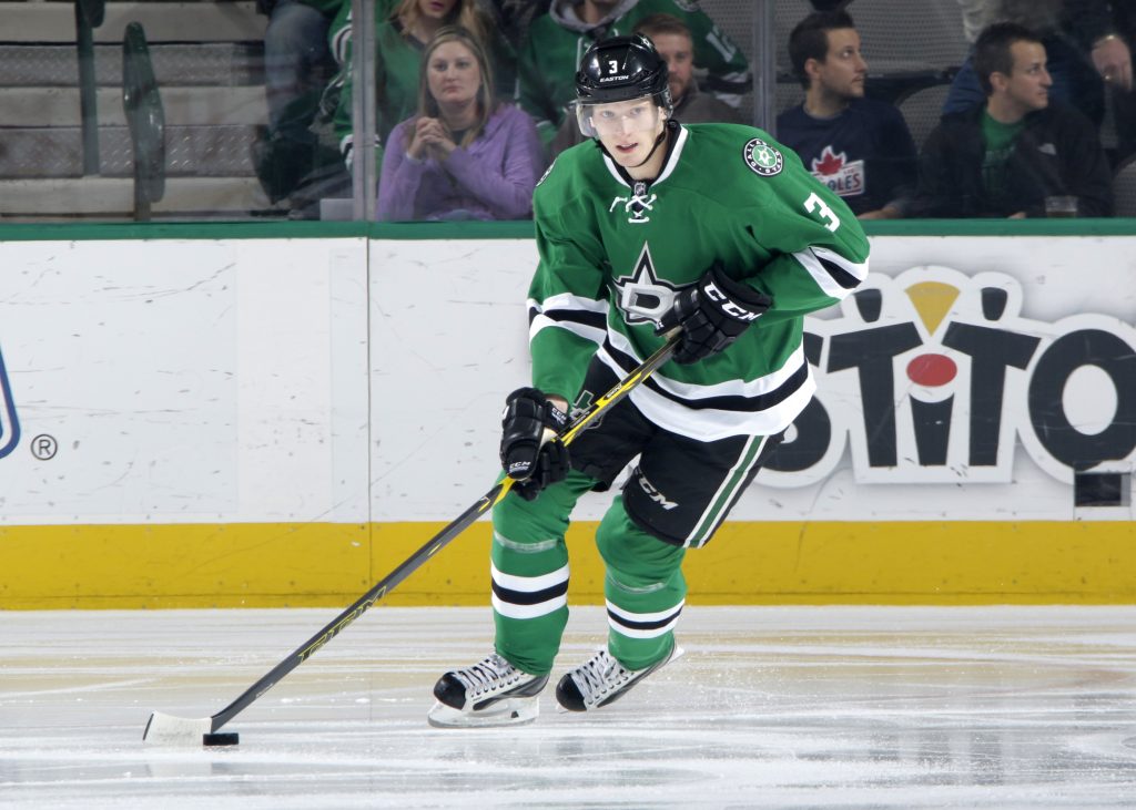 DALLAS, TX - JANUARY 20: John Klingberg #3 of the Dallas Stars handles the puck against the Boston Bruins at the American Airlines Center on January 20, 2015 in Dallas, Texas. (Photo by Glenn James/NHLI via Getty Images)